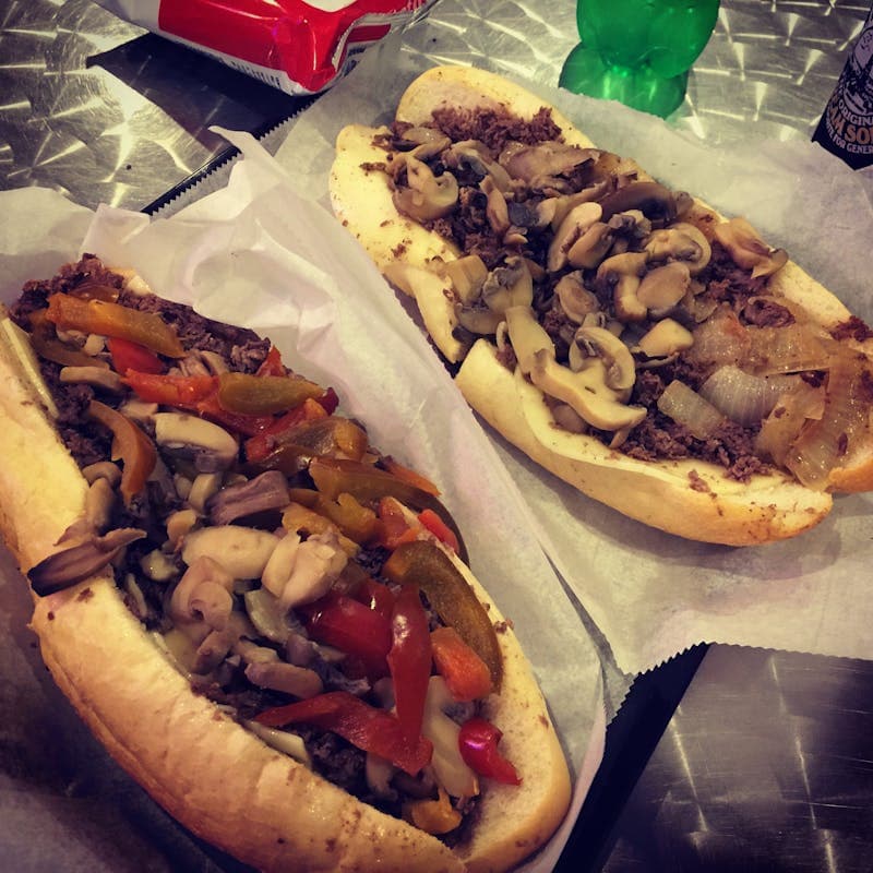 Philly cheesesteaks on hoagie rolls